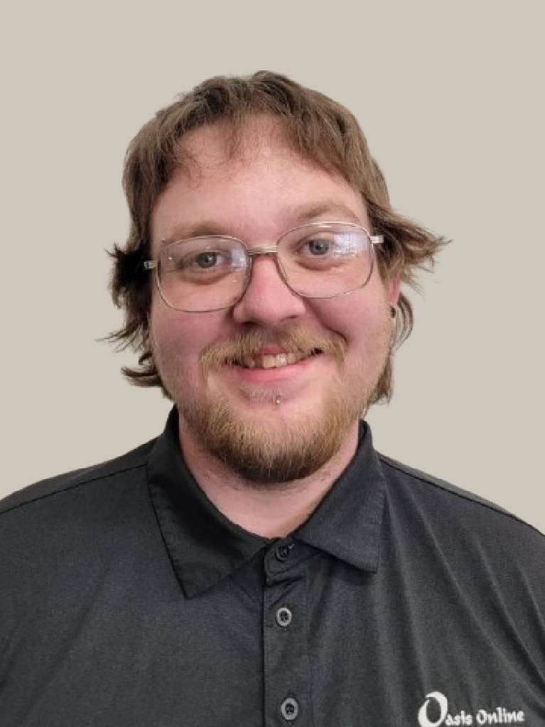 Smiling man wearing glasses and black polo