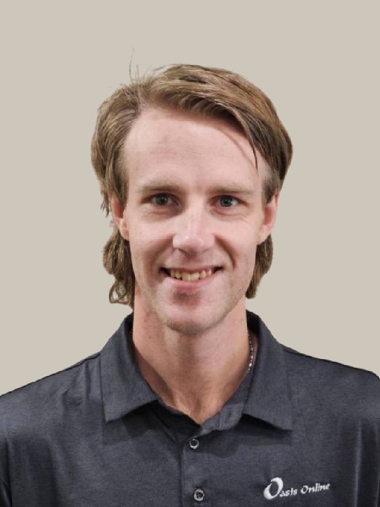 Smiling man wearing charcoal collared shirt