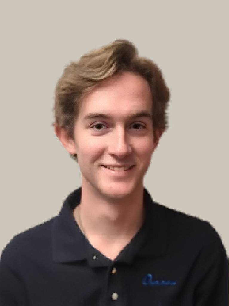 Smiling young man in navy polo shirt
