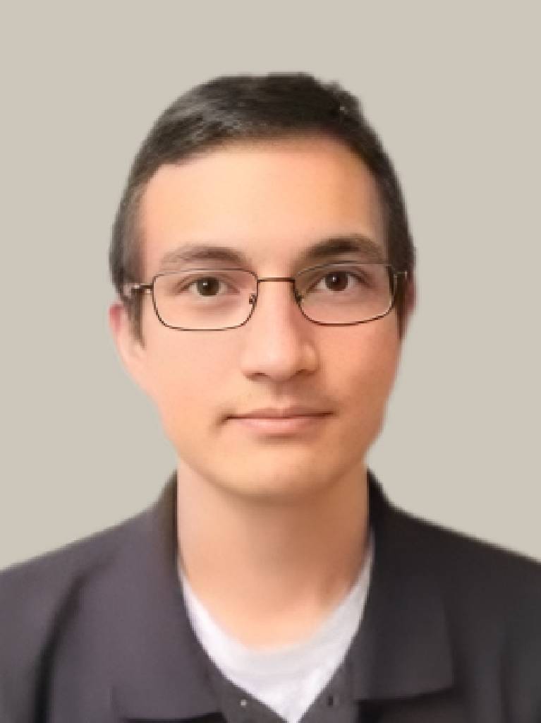 Person wearing glasses on neutral background