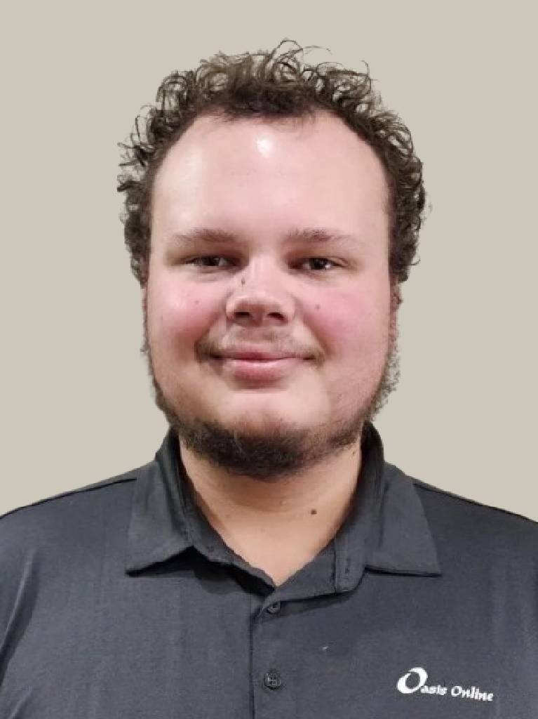 Smiling man with curly hair and beard