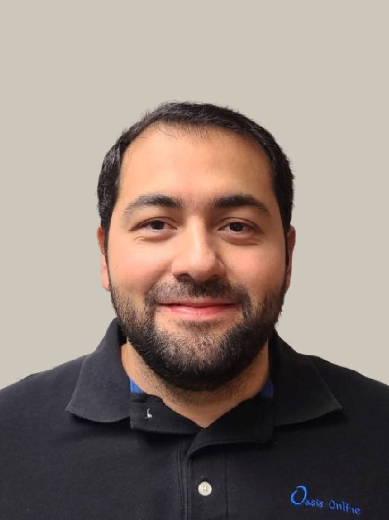 Bearded man in dark polo smiling