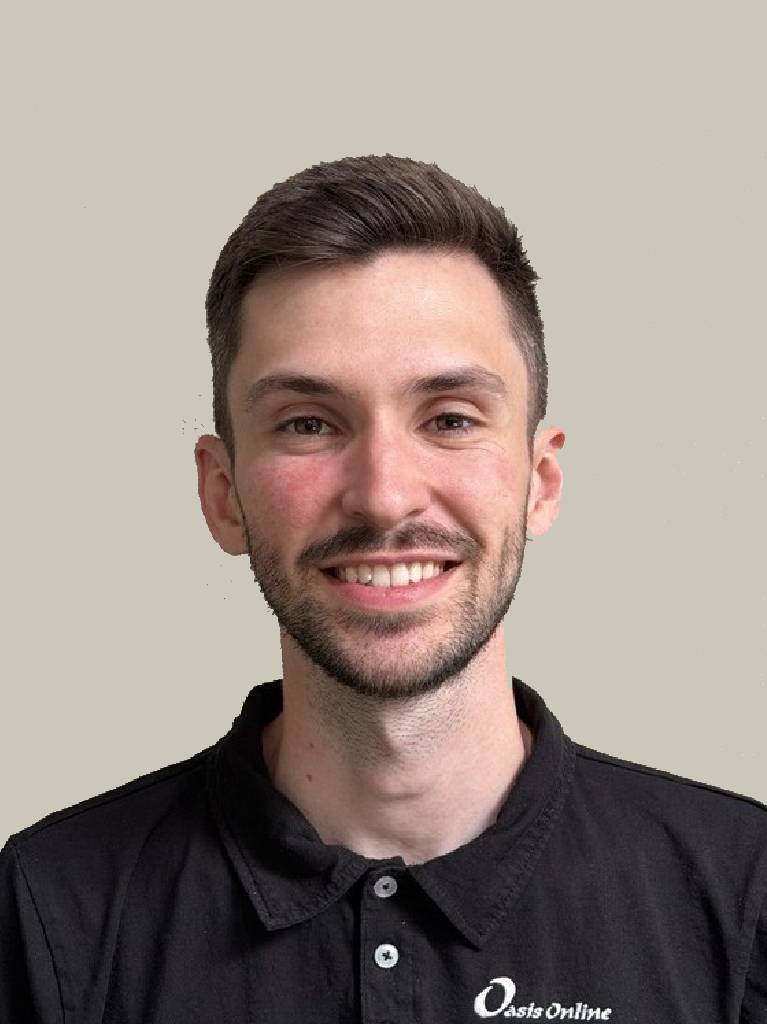 Close-up portrait of smiling man wearing dark polo